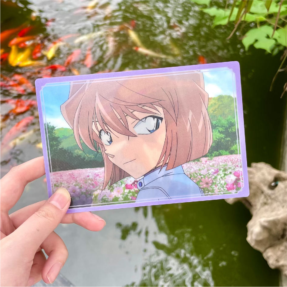 Hand-held anime lenticular card outdoors