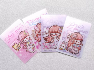 Rectangular pastel pink and purple chibi anime character stickers arranged in a row
