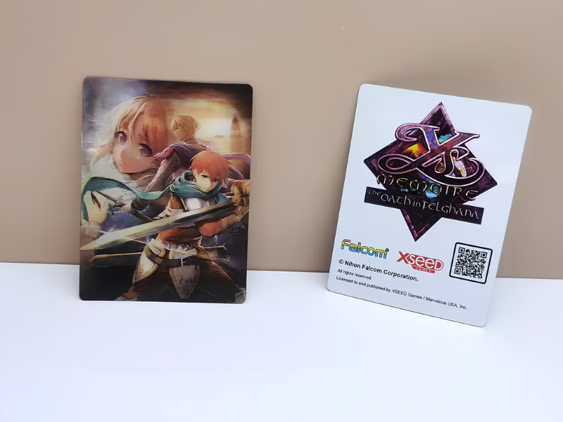 Two upright rectangular stickers showing full-color anime artwork on the front and a white printed backing with logo and QR code on the right